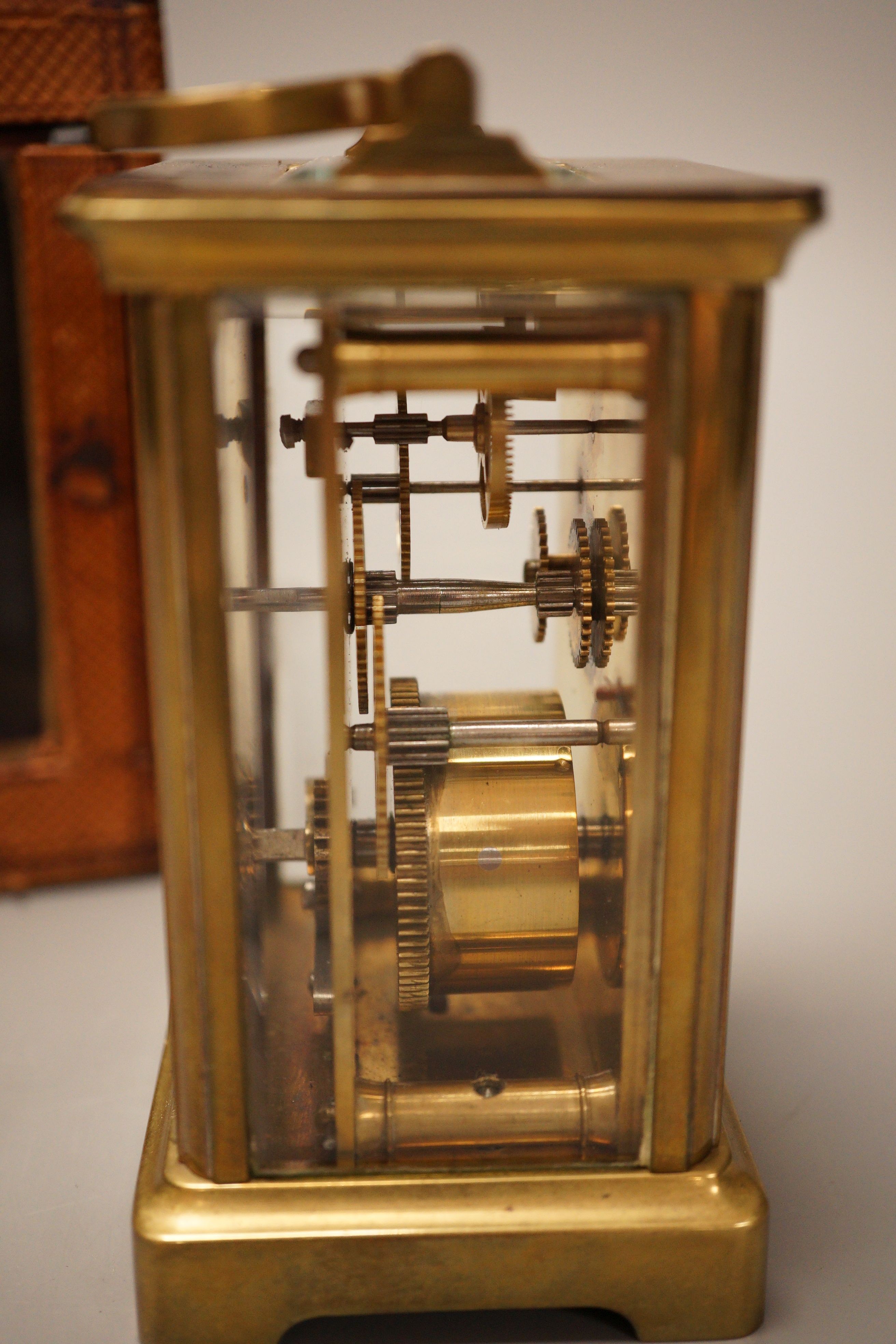 A leather cased brass carriage timepiece, retailed by Bracher & Sydenham